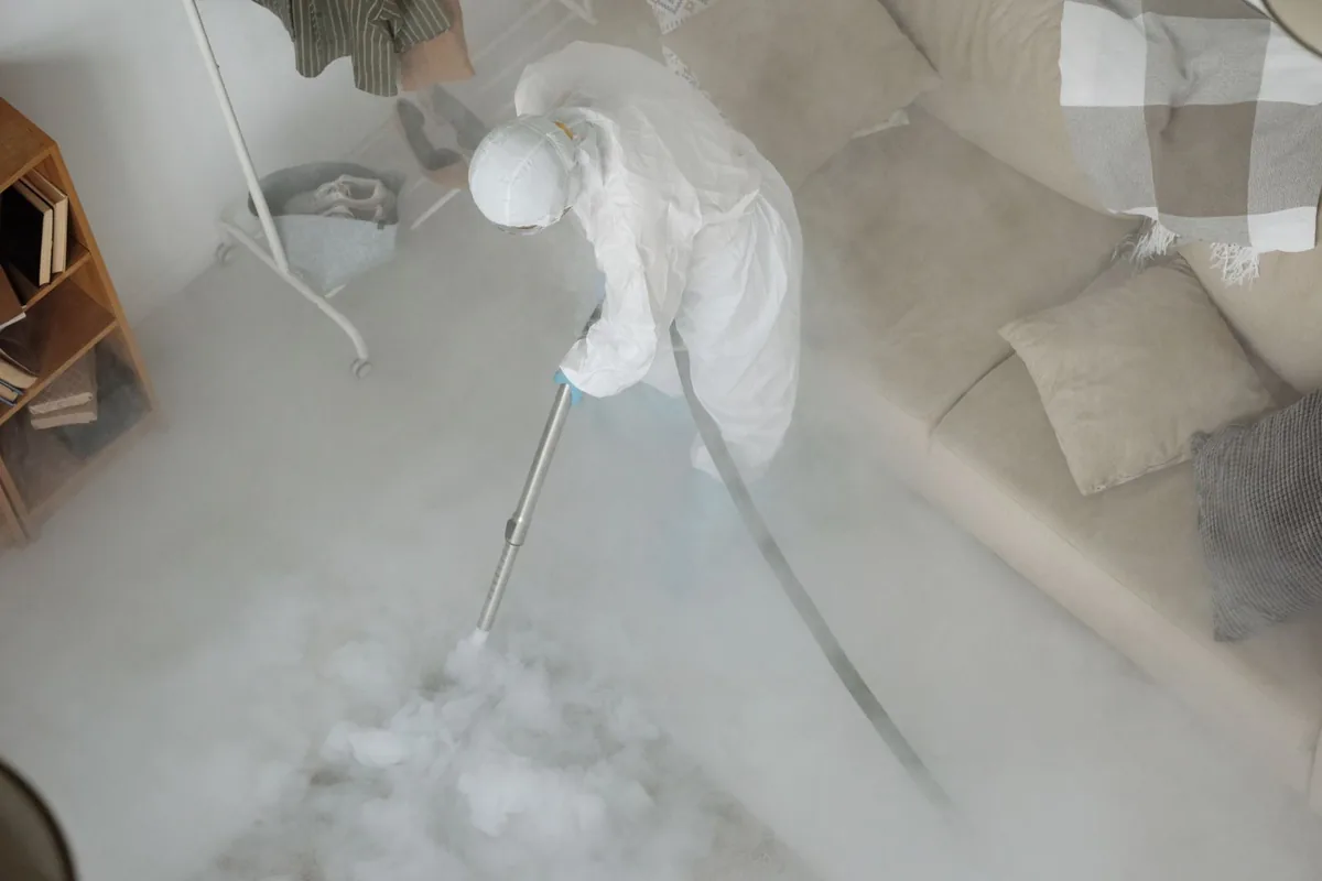 Biohazard cleanup technician in protective equipment, Wilmore, KY
